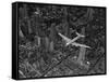 Aerial View of a DC-4 Passenger Plane Flying over Midtown Manhattan-Margaret Bourke-White-Framed Stretched Canvas