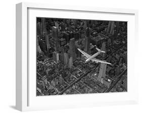 Aerial View of a DC-4 Passenger Plane Flying over Midtown Manhattan-Margaret Bourke-White-Framed Photographic Print