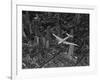 Aerial View of a DC-4 Passenger Plane Flying over Midtown Manhattan-Margaret Bourke-White-Framed Photographic Print