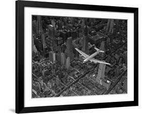 Aerial View of a DC-4 Passenger Plane Flying over Midtown Manhattan-Margaret Bourke-White-Framed Photographic Print