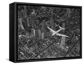 Aerial View of a Dc-4 Passenger Plane in Flight over Manhattan-Margaret Bourke-White-Framed Stretched Canvas