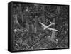 Aerial View of a Dc-4 Passenger Plane in Flight over Manhattan-Margaret Bourke-White-Framed Stretched Canvas