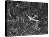 Aerial View of a Dc-4 Passenger Plane in Flight over Manhattan-Margaret Bourke-White-Stretched Canvas