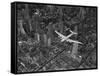 Aerial View of a Dc-4 Passenger Plane in Flight over Manhattan-Margaret Bourke-White-Framed Stretched Canvas