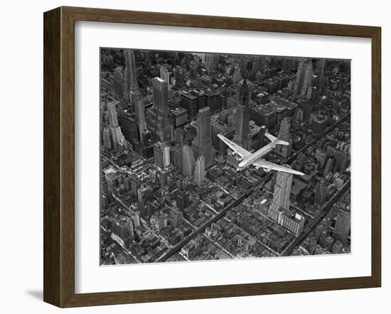 Aerial View of a Dc-4 Passenger Plane in Flight over Manhattan-Margaret Bourke-White-Framed Photographic Print