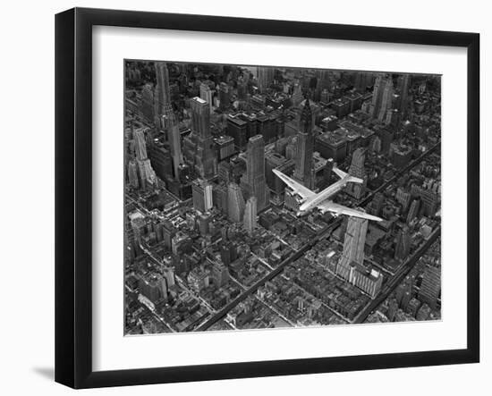 Aerial View of a Dc-4 Passenger Plane in Flight over Manhattan-Margaret Bourke-White-Framed Photographic Print