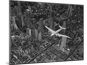 Aerial View of a Dc-4 Passenger Plane in Flight over Manhattan-Margaret Bourke-White-Mounted Photographic Print