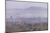 Aerial View of Ancient Temples of Bagan at Sunrise with Mount Popa in Background, Myanmar-Harry Marx-Mounted Photographic Print