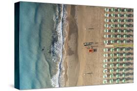 Aerial view of beach umbrellas and sunbeds in tidy rows during summer, Vieste-Roberto Moiola-Stretched Canvas