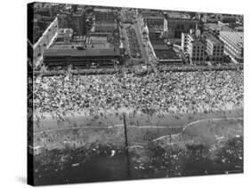 Aerial View of Crowds Enjoying a Hot 4th of July at Rockaway Beach-Sam Shere-Stretched Canvas