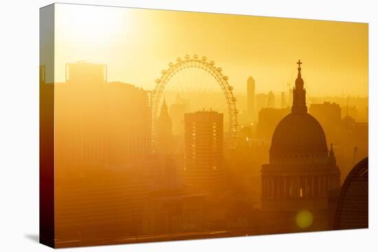 Aerial view of London skyline at sunset, including London Eye and St. Paul's Cathedral, London-Ed Hasler-Stretched Canvas