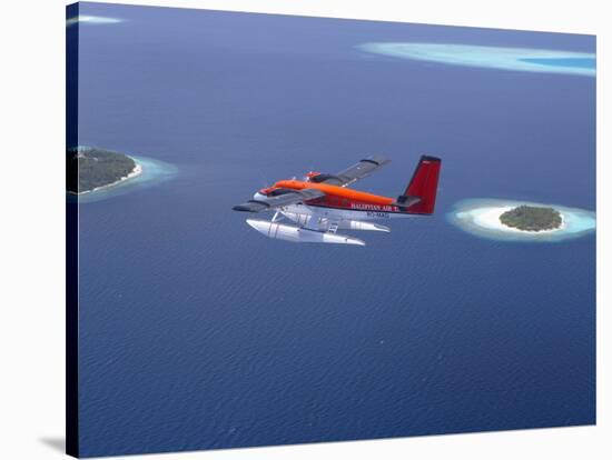 Aerial View of Maldivian Air Taxi Flying Above Islands in the Maldives, Indian Ocean-Papadopoulos Sakis-Stretched Canvas