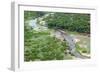 Aerial view of river, African Elephants (Loxodonta africana) and tourist lodge, Botswana-Jean Hosking-Framed Photographic Print