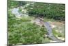 Aerial view of river, African Elephants (Loxodonta africana) and tourist lodge, Botswana-Jean Hosking-Mounted Photographic Print