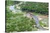 Aerial view of river, African Elephants (Loxodonta africana) and tourist lodge, Botswana-Jean Hosking-Stretched Canvas