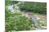 Aerial view of river, African Elephants (Loxodonta africana) and tourist lodge, Botswana-Jean Hosking-Mounted Photographic Print