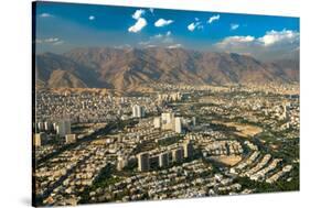 Aerial view of Tehran facing North towards the Alborz Mountains, Tehran, Iran, Middle East-James Strachan-Stretched Canvas