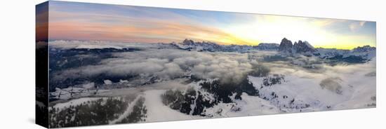 Aerial view of the snowcapped Sassolungo and Sassopiatto mountains at dawn, Seiser Alm-Roberto Moiola-Stretched Canvas