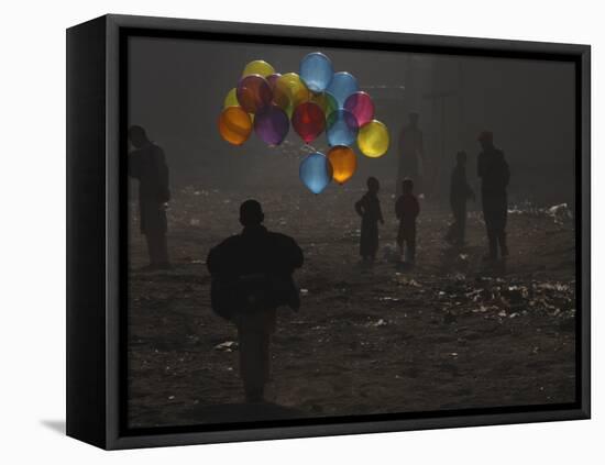 Afghan Boy Runs with Balloons to Join His Friends in Dusty Alley in Kabul, Afghanistan-null-Framed Stretched Canvas