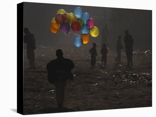 Afghan Boy Runs with Balloons to Join His Friends in Dusty Alley in Kabul, Afghanistan-null-Stretched Canvas