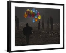 Afghan Boy Runs with Balloons to Join His Friends in Dusty Alley in Kabul, Afghanistan-null-Framed Photographic Print