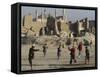 Afghan Boys Play Soccer Near a Mosque and Ruined Buildings During the Early Morning-null-Framed Stretched Canvas