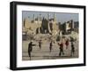 Afghan Boys Play Soccer Near a Mosque and Ruined Buildings During the Early Morning-null-Framed Premium Photographic Print