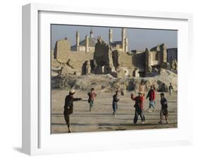 Afghan Boys Play Soccer Near a Mosque and Ruined Buildings During the Early Morning-null-Framed Premium Photographic Print