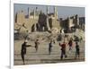 Afghan Boys Play Soccer Near a Mosque and Ruined Buildings During the Early Morning-null-Framed Photographic Print