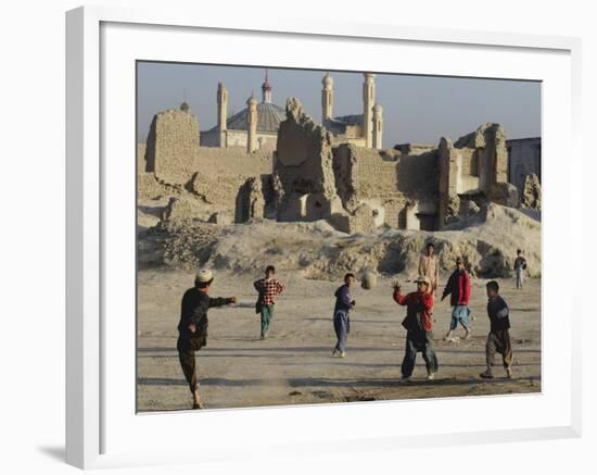 Afghan Boys Play Soccer Near a Mosque and Ruined Buildings During the Early Morning-null-Framed Photographic Print