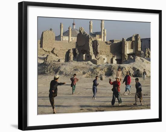 Afghan Boys Play Soccer Near a Mosque and Ruined Buildings During the Early Morning-null-Framed Photographic Print