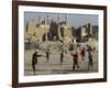 Afghan Boys Play Soccer Near a Mosque and Ruined Buildings During the Early Morning-null-Framed Photographic Print