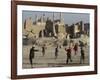 Afghan Boys Play Soccer Near a Mosque and Ruined Buildings During the Early Morning-null-Framed Photographic Print