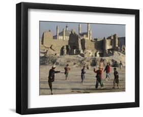 Afghan Boys Play Soccer Near a Mosque and Ruined Buildings During the Early Morning-null-Framed Photographic Print