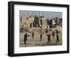 Afghan Boys Play Soccer Near a Mosque and Ruined Buildings During the Early Morning-null-Framed Photographic Print