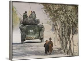 Afghan Boys Walk Along a Path While International Security Assistance Force (Isaf)-null-Framed Photographic Print