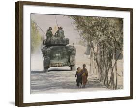 Afghan Boys Walk Along a Path While International Security Assistance Force (Isaf)-null-Framed Photographic Print