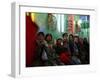 Afghan Boys Watch a Movie on a Television, Unseen, as They Eat Ice Cream at an Ice Cream Shop-Rodrigo Abd-Framed Photographic Print