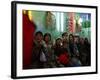 Afghan Boys Watch a Movie on a Television, Unseen, as They Eat Ice Cream at an Ice Cream Shop-Rodrigo Abd-Framed Photographic Print