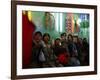 Afghan Boys Watch a Movie on a Television, Unseen, as They Eat Ice Cream at an Ice Cream Shop-Rodrigo Abd-Framed Photographic Print