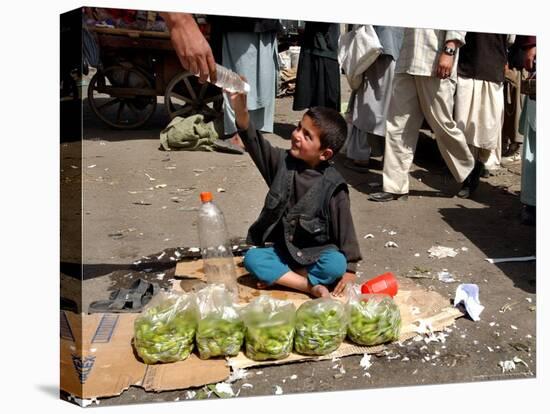 Afghan Child 5, Receives a Bottle of Water-Musadeq Sadeq-Stretched Canvas