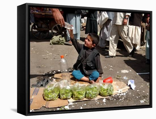 Afghan Child 5, Receives a Bottle of Water-Musadeq Sadeq-Framed Stretched Canvas