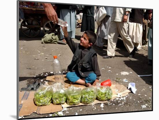 Afghan Child 5, Receives a Bottle of Water-Musadeq Sadeq-Mounted Photographic Print