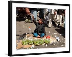 Afghan Child 5, Receives a Bottle of Water-Musadeq Sadeq-Framed Photographic Print