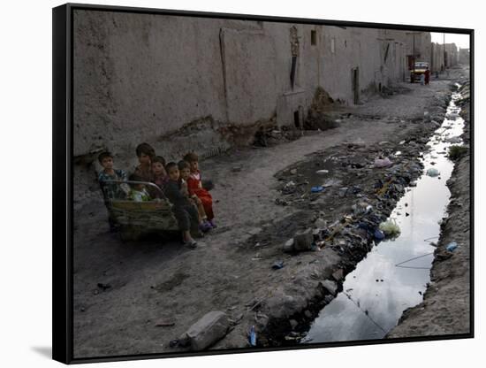 Afghan Children Sit Together Aboard an Old Cart-null-Framed Stretched Canvas