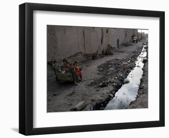 Afghan Children Sit Together Aboard an Old Cart-null-Framed Photographic Print