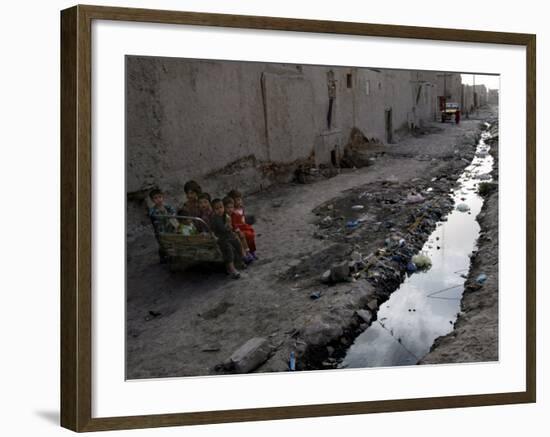 Afghan Children Sit Together Aboard an Old Cart-null-Framed Photographic Print