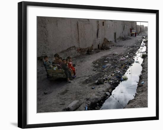 Afghan Children Sit Together Aboard an Old Cart-null-Framed Photographic Print