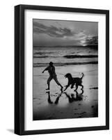 Afghan Dog Roaming across Beach with Girl at Sundown, During Preparation for Westminister Show-George Silk-Framed Premium Photographic Print