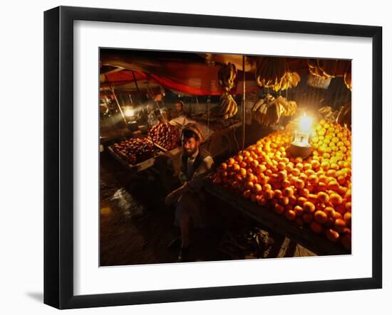 Afghan Fruit Vendor Waits for Customer at a Local Market in Kabul, Afghanistan-null-Framed Photographic Print